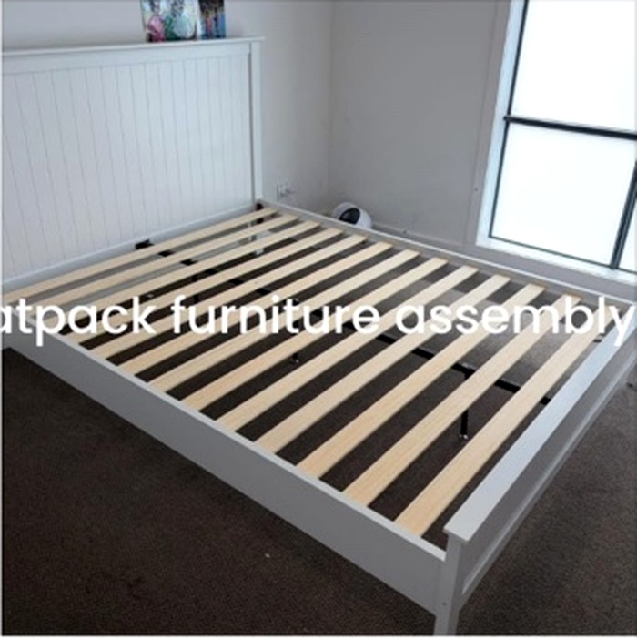 Flatpack bed frame assembled in a bedroom