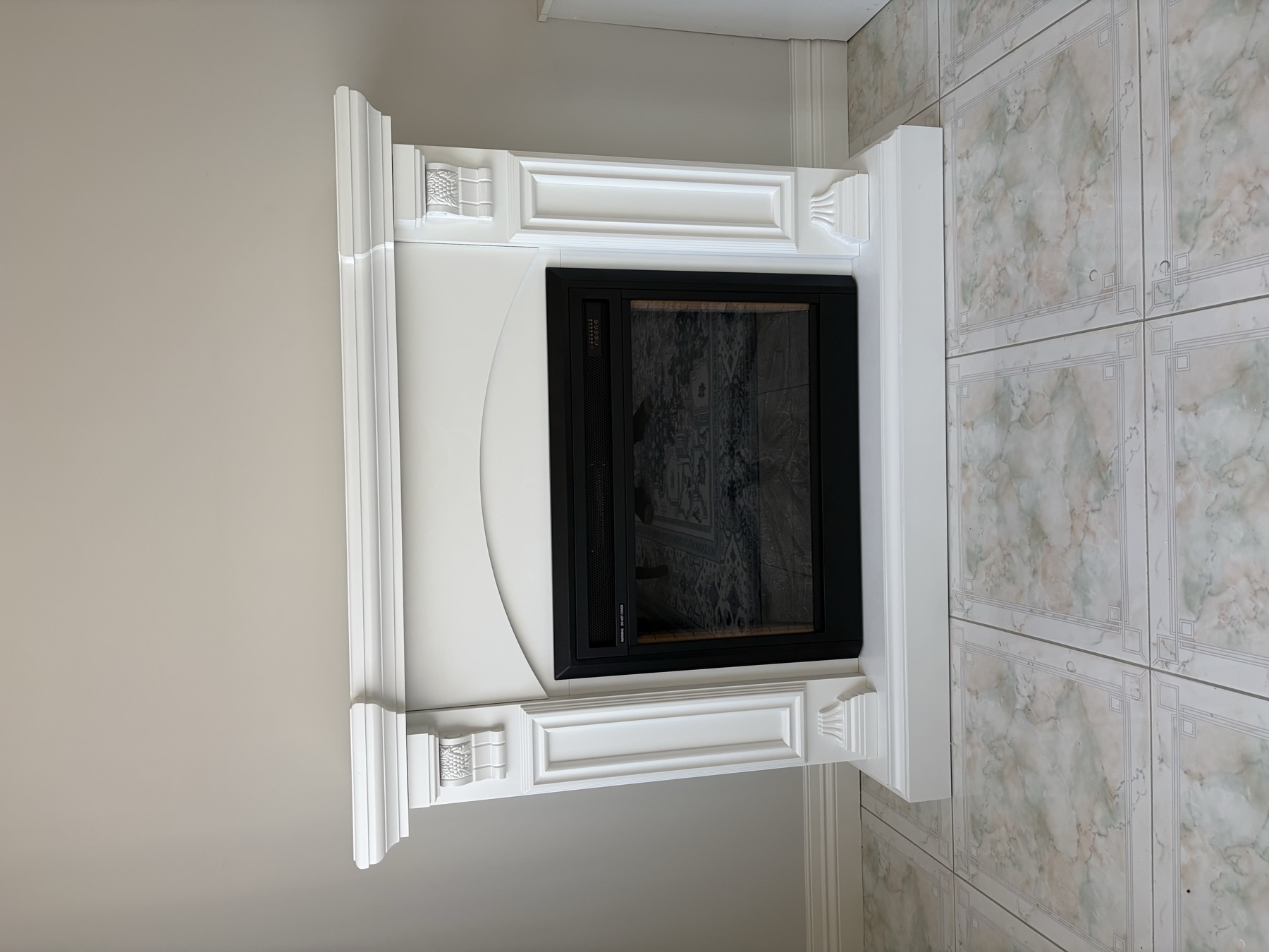 Finished electric fireplace installed into a wall feature
